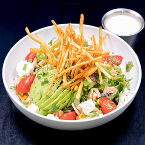 Salad with avocado and crispy fries
