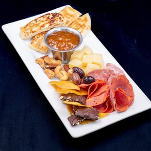 Platter with meat, cheese and pita