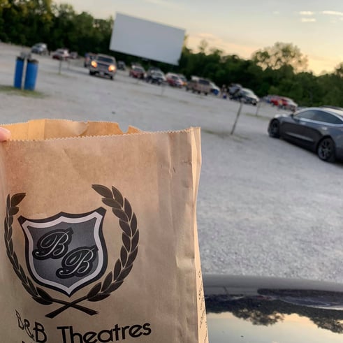 popcorn bag with drive-in screen in background