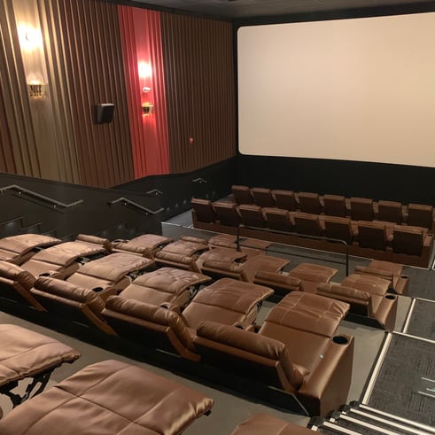 recliners facing movie screen