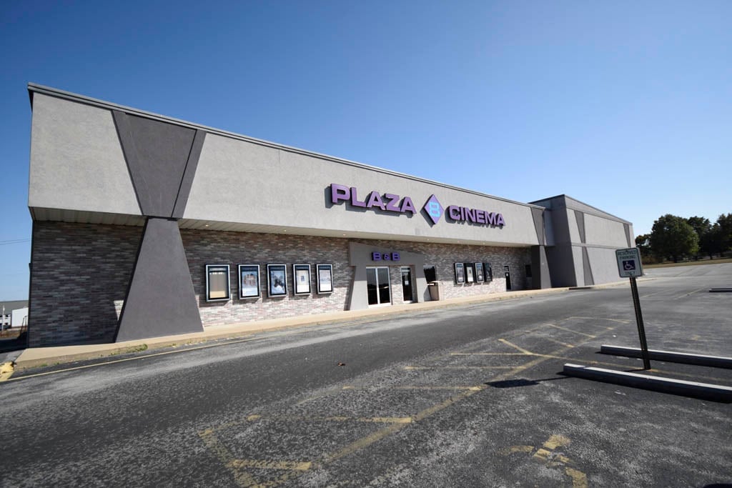 exterior of building with sign that reads PLAZA 8 CINEMA