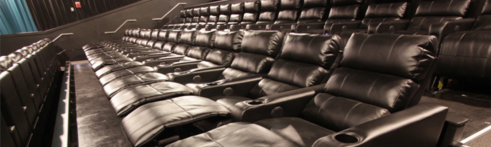 two rows of empty recliners in the reclined position