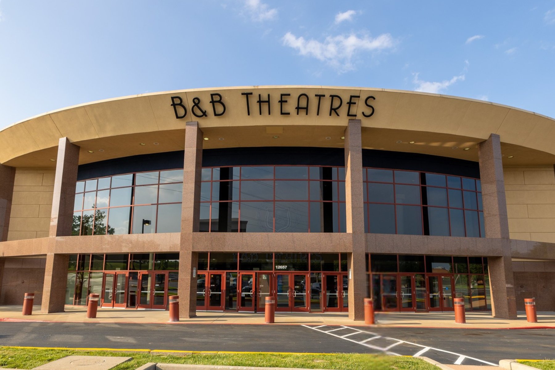 exterior of building. Black letters read B&B THEATRES