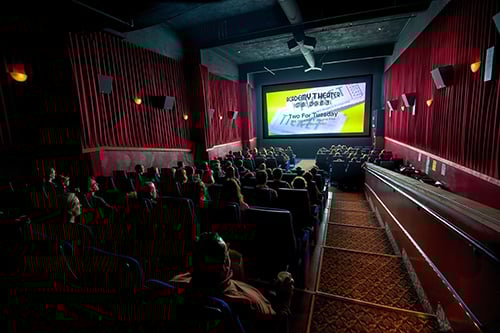 big screen ads in an auditorium