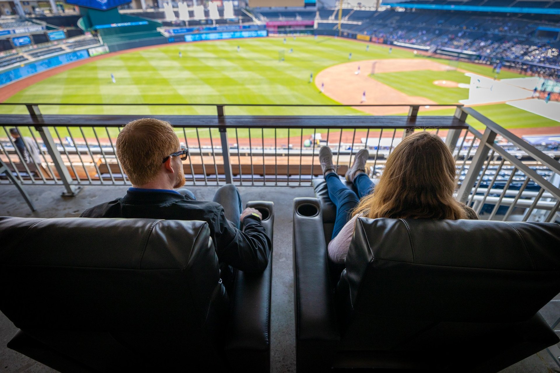 Guests sitting in B&B Recliners at Kauffman Stadium watching a Royals game