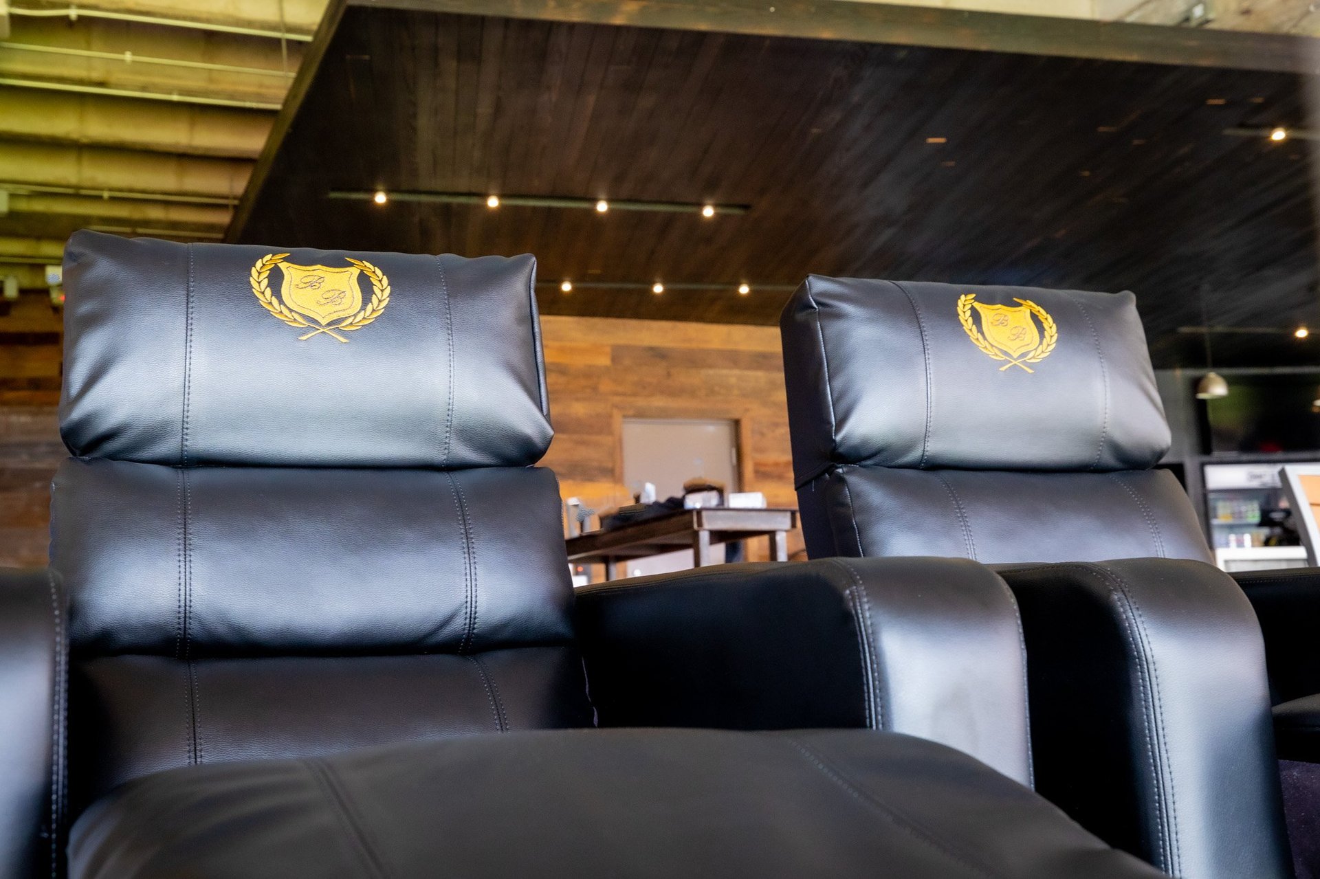 front of 2 black reclining chairs with B&B logos