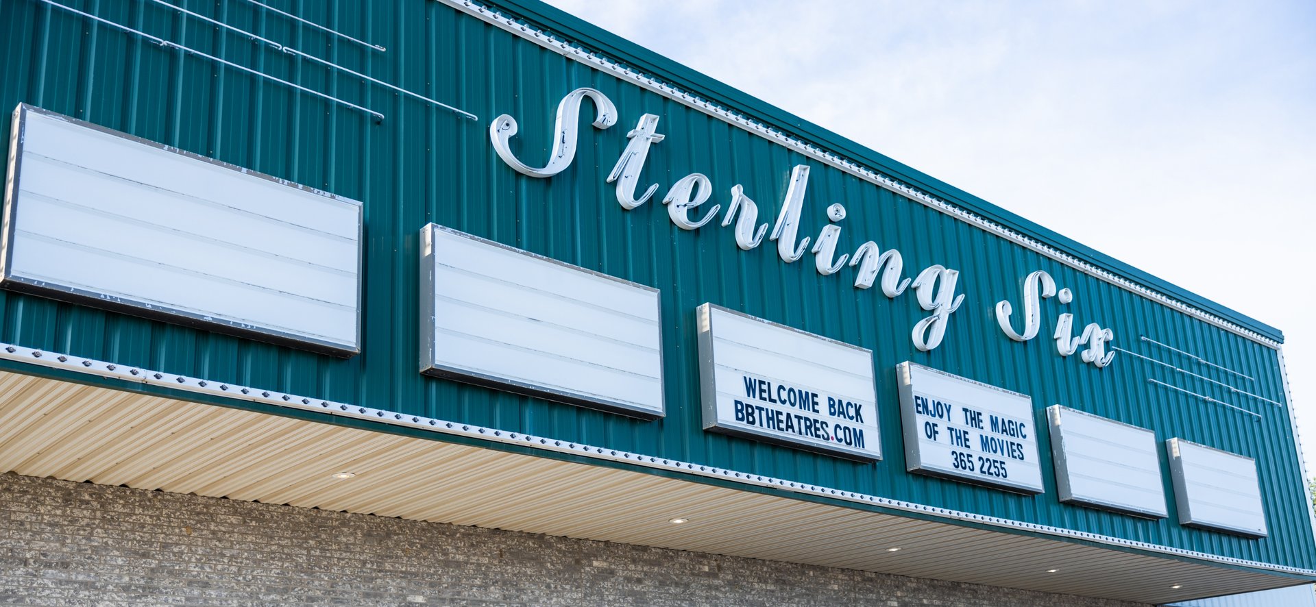 exterior of theatre showing Sterling Six sign