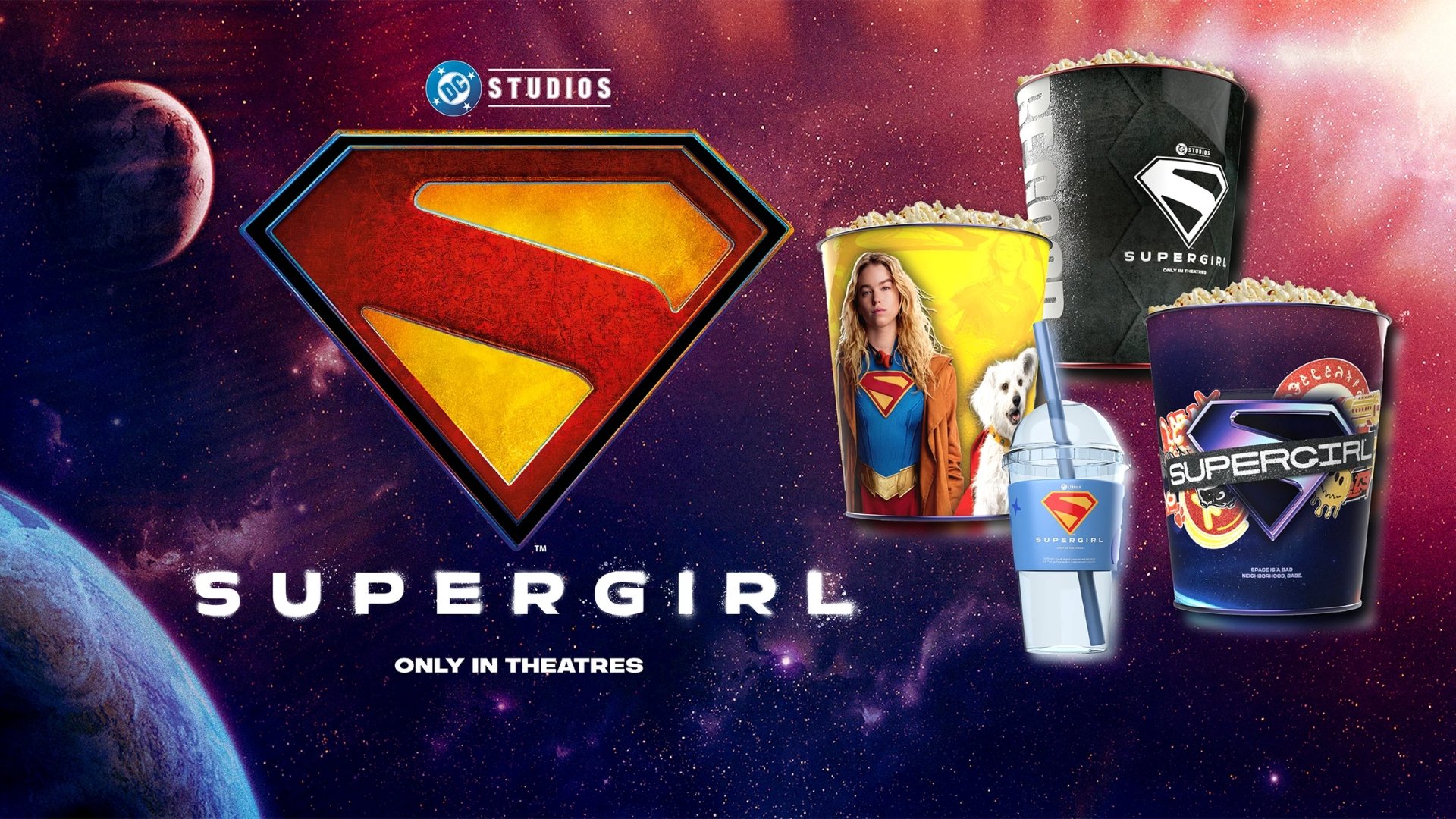 space background. the left side of the image features a giant Supergirl S and says SUPERGIRL ONLY IN THEATRES. The right of the image features 3 popcorn tubs & 1 drink cup with straw.
