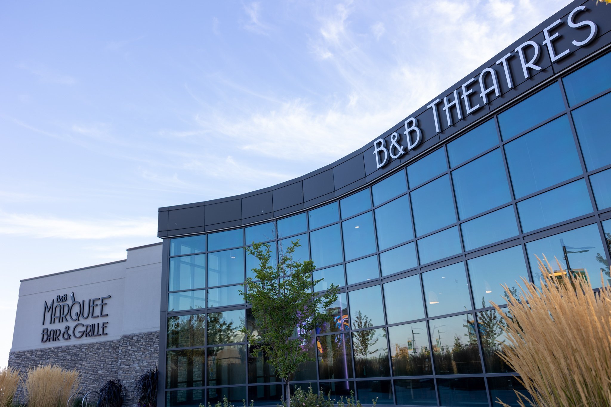 exterior of building. Signage reads B&B Marquee Bar & Grille and B&B THEATRES