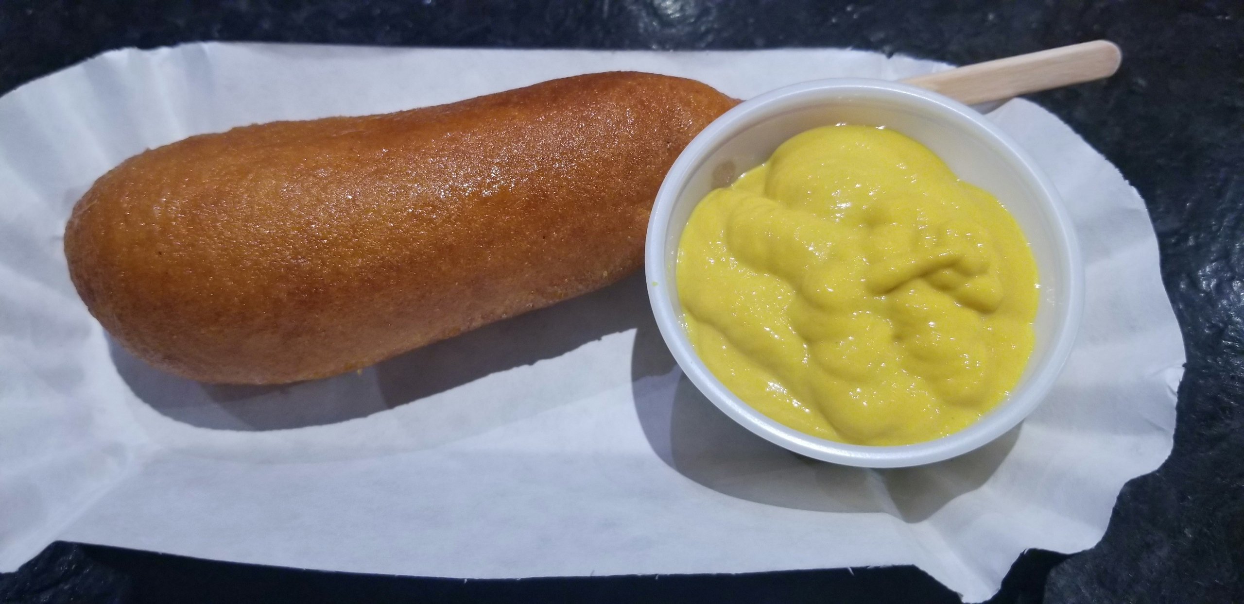 Corn dog with mustard
