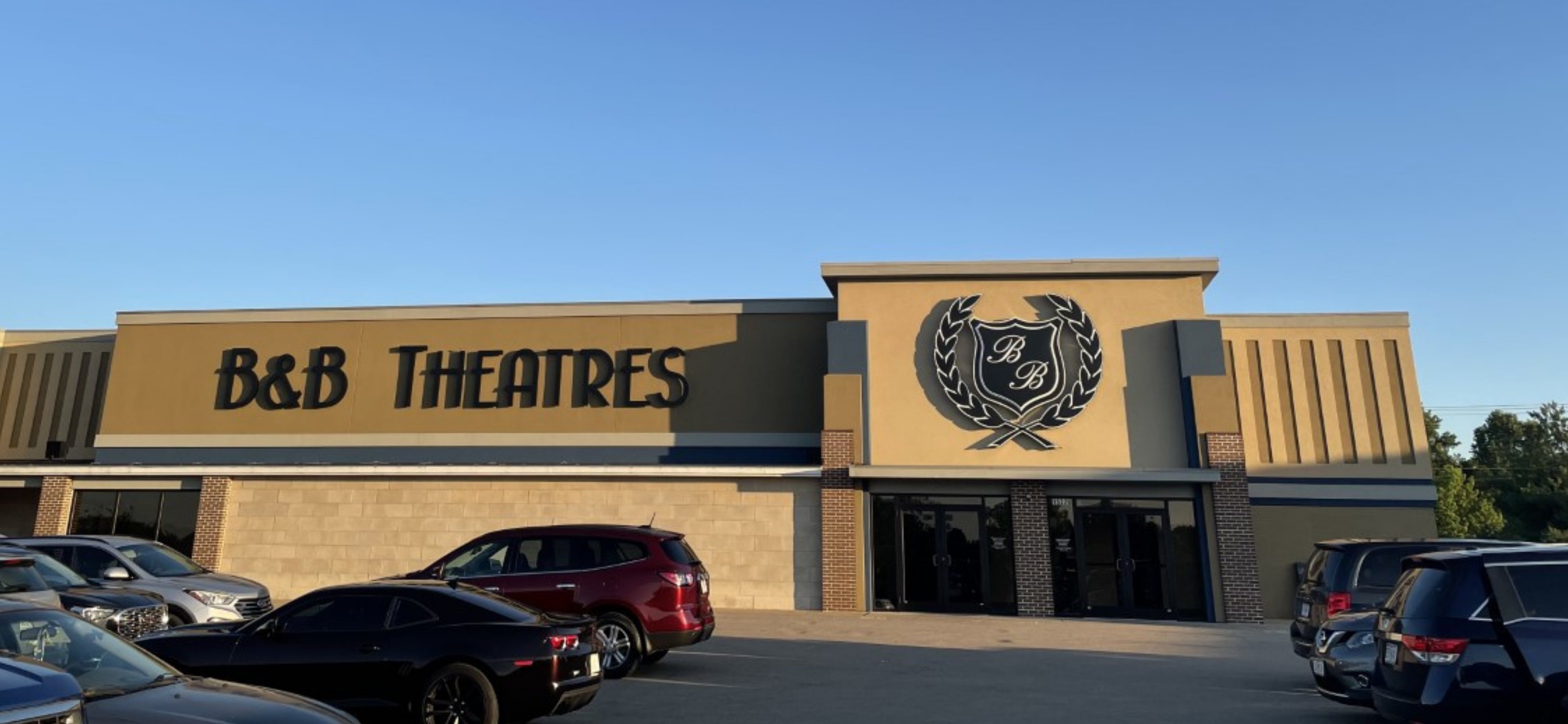 exterior of building at golden hour showing B&B Sign