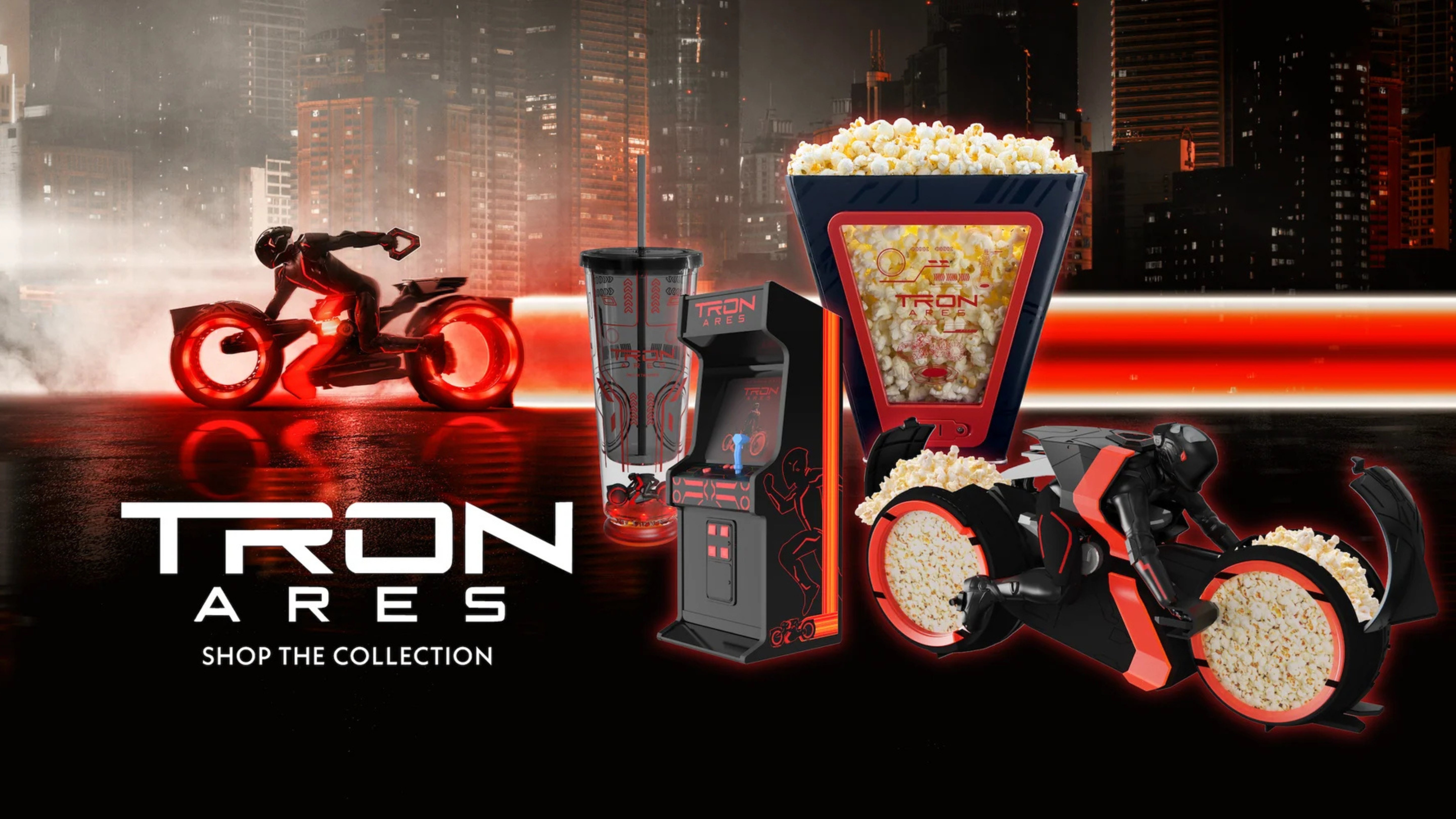 dark cityscape in the background. Red neon horizontal line across the middle following a rider on a tron bike. In the foreground white text reads: Tron Ares Shop the Collection. To the right are images of the merch items: 1 popcorn tub, 1 looks like an arcade game, the 3rd looks like a person riding a tron bike with popcorn in the wheels. also pictured a drink cup